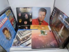 A crate containing a small quantity of LPs to include The Beatles 1967/1970's double album, Elvis,