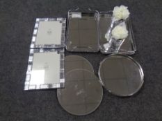 A box of Next Harper serving trays, mirrored place mats on stand, artificial flowers,