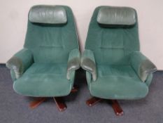 A pair of 20th century swivel armchairs upholstered in green suede and leather