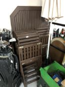 A octagonal wooden garden table (dismantled) together with 6 folding garden chairs,