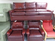 A 3 piece Burgundy leather 3 piece lounge suite