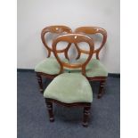 A set of three Victorian mahogany balloon back chairs upholstered in a green dralon