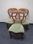 A set of three Victorian mahogany balloon back chairs upholstered in a green dralon