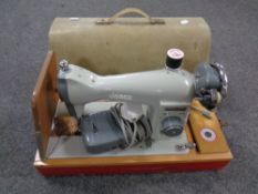 A 20th century Jones electric sewing machine in case