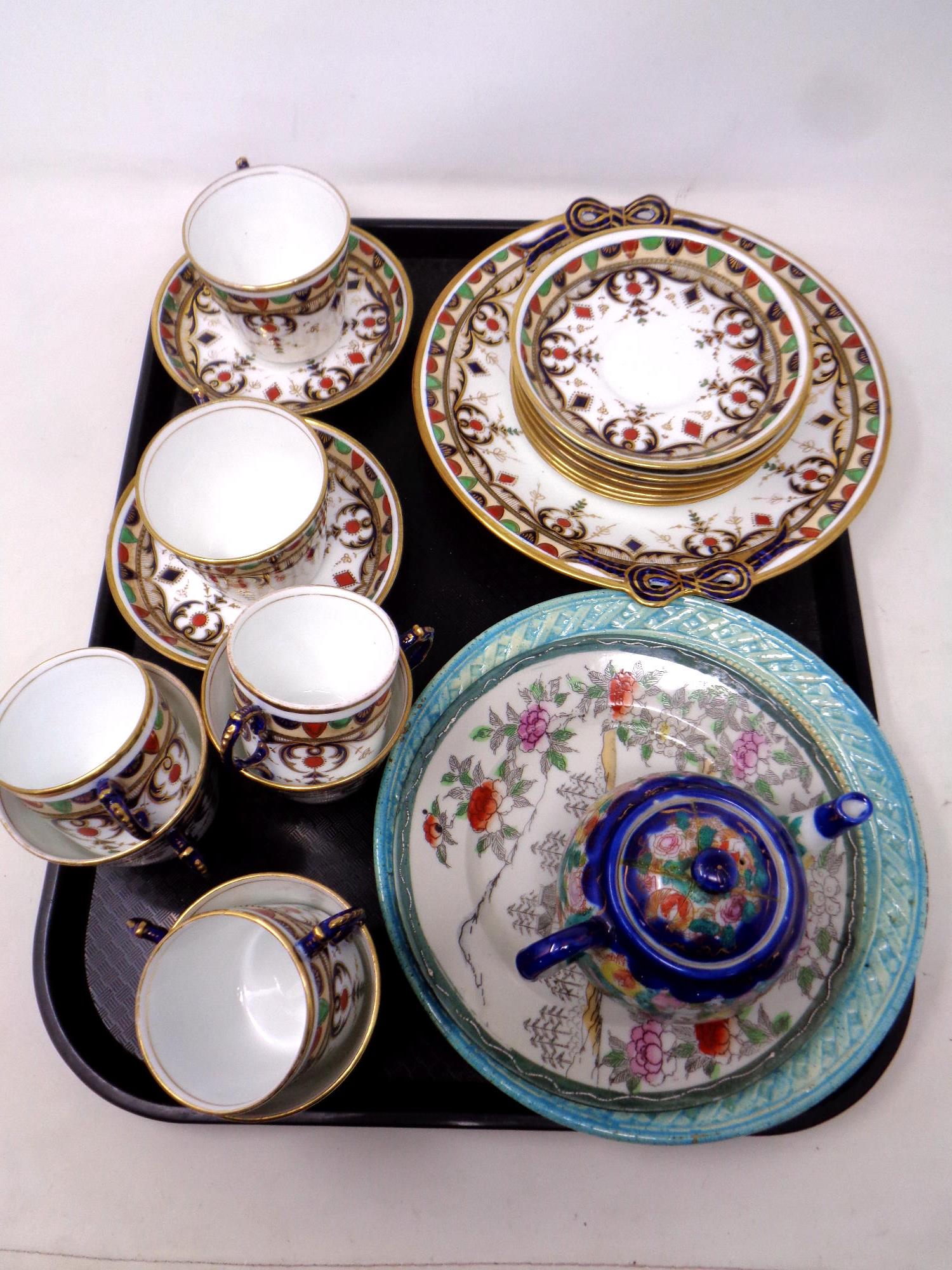 A tray of a quantity antique gilt tea china,