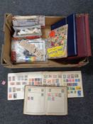 A box containing a quantity of albums and loose stamps of the world,