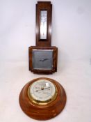 An Edwardian oak barometer together with a further circular barometer by Short & Mason of London