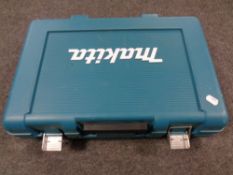 A Makita power drill case containing battery and charger only
