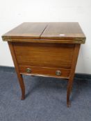 A Edwardian mahogany sewing box fitted a drawer on raised legs