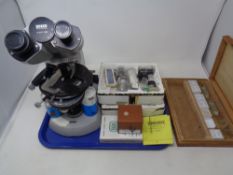 A Zeiss West German microscope together with a quantity of microscope accessories