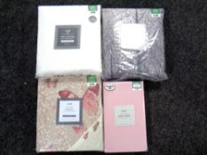 A basket of four Dunelm duvet cover sets and valances (new and sealed)
