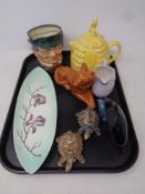 A tray of assorted ceramics to include Royal Doulton Mr Pickwick Toby jug, Poole dolphin,