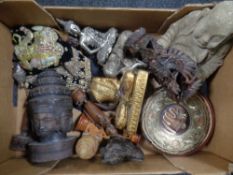 A box containing a quantity of eastern tourist carvings and ornaments together with a concrete