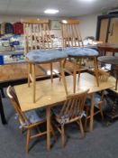A set of five 20th century stick back dining chairs together with a flap sided kitchen table