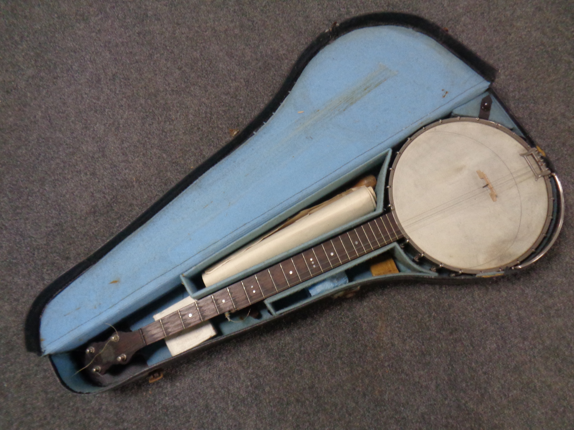 A vintage banjo in carry case
