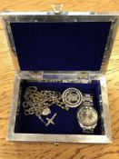 A ornate jewellery box containing wrist watch,