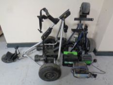 Two electric golf carts with batteries and one charger