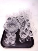 A tray of cut glass champagne and brandy glasses, fruit bowl,