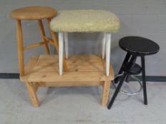 A pine coffee table together with 3 stools