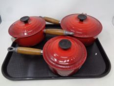 3 Le Creuset ceramic wooden handled saucepans.