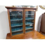 An Edwardian mahogany wall mounted curio cabinet