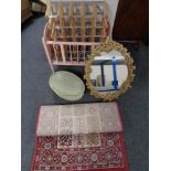 A mid 20th century dolls cot together with a wine rack, a gilt chalk framed mirror,