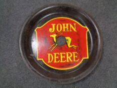 A Simba cast iron double disc bearing John Deere hand painted advertising
