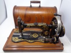An early 20th century Singer New Family model 12K sewing machine in case