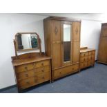 A Edwardian three piece bedroom suite comprising of mirror door wardrobe fitted with draw,