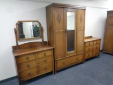 A Edwardian three piece bedroom suite comprising of mirror door wardrobe fitted with draw,