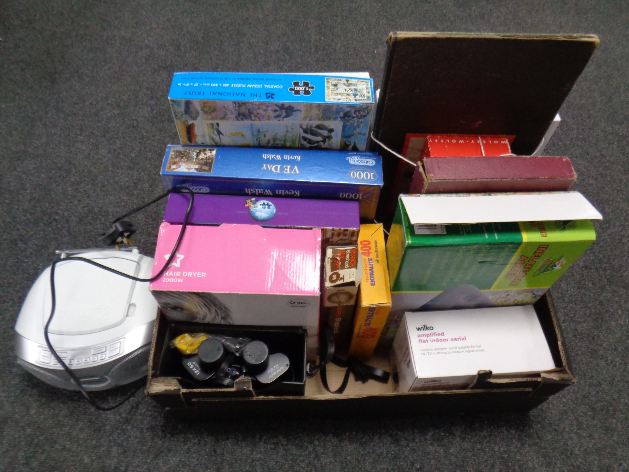 A box containing miscellany to include vintage board games, jigsaws, electricals,