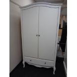 A contemporary arch topped double door wardrobe fitted with draw on raised legs (white)