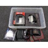 A plastic storage box with lid containing a quantity of digital video cameras,