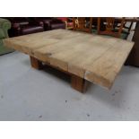 A large square pine coffee table