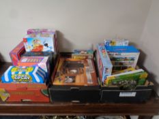 Three boxes containing a quantity of assorted board games and jigsaws