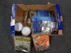 A box containing miscellanea to include heavy duty staple guns, laser levels,