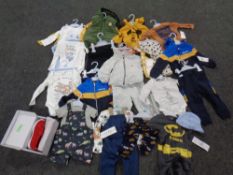 A box of a quantity of baby to two-year clothing, tagged and new,