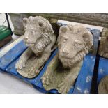 A pair of concrete recumbent lions.