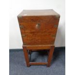 A 19th century mahogany brass bound wine box on stand (12 bottles)