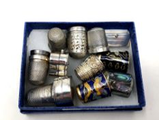 A group of thimbles including silver and cloisonne,