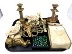 A tray of pair of brass candlesticks, cherub ornaments, marbles, Brownie camera,