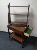 An Edwardian three tier wall shelf together with a two tier trolley