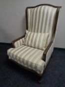A good quality Barker and Stonehouse French style high backed armchair in two tone striped fabric