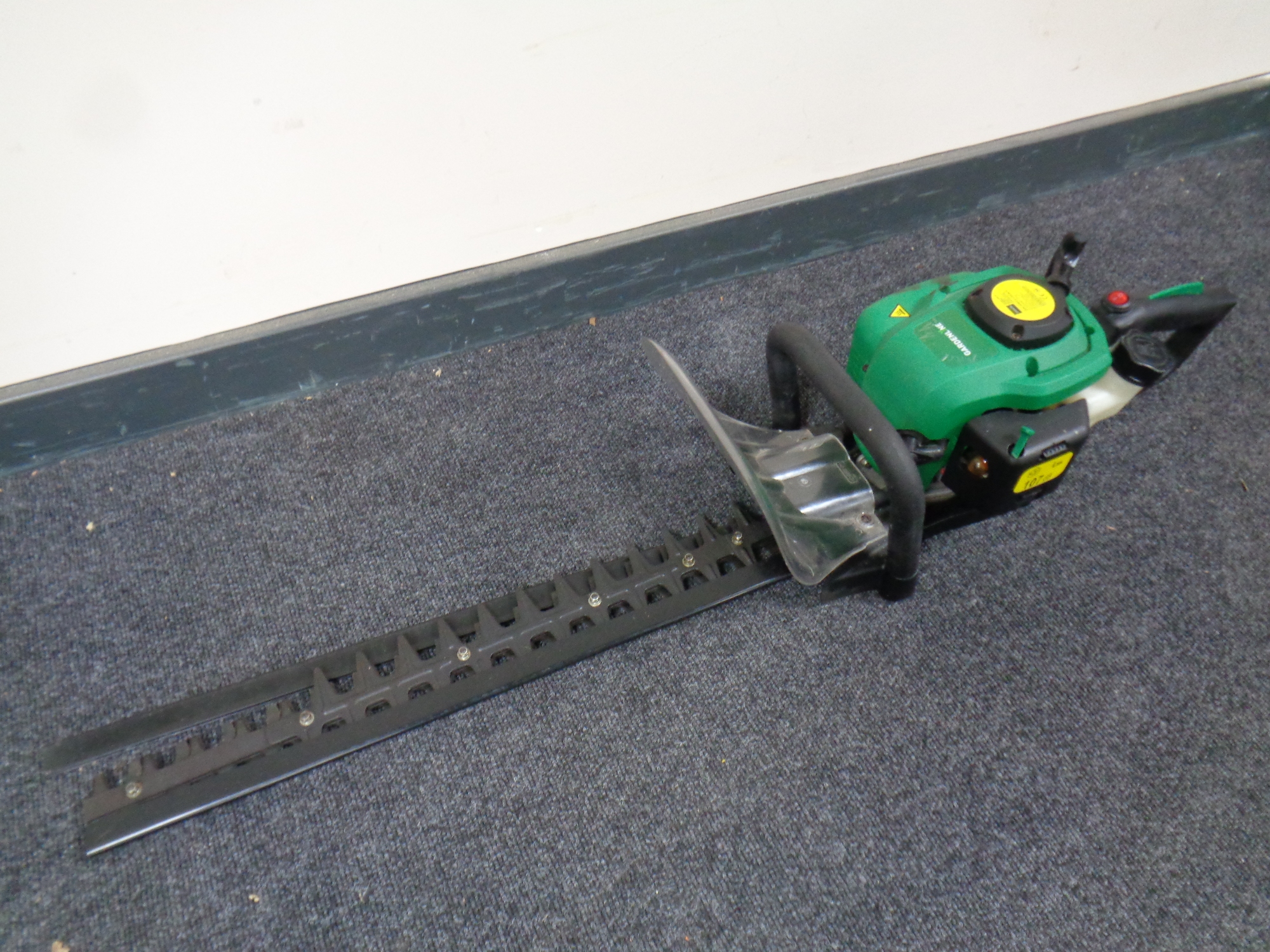 A garden line petrol hedge trimmer