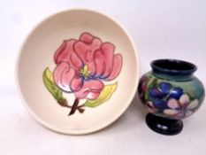 Two pieces of Moorcroft to include a shallow bowl and small tubelined vase (2)