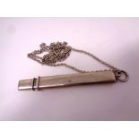 A vintage silver pencil on chain.