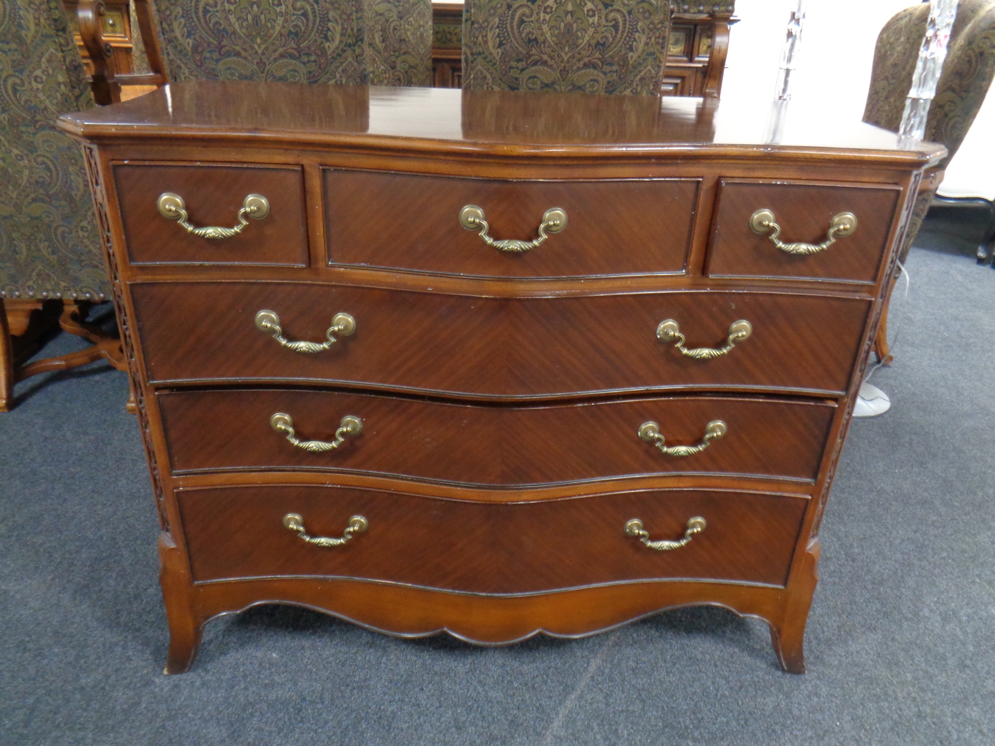 A good quality Barker and Stonehouse Victorian style serpentine fronted six drawer chest