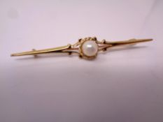 A 9ct gold bar brooch set with a pearl.