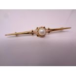 A 9ct gold bar brooch set with a pearl.