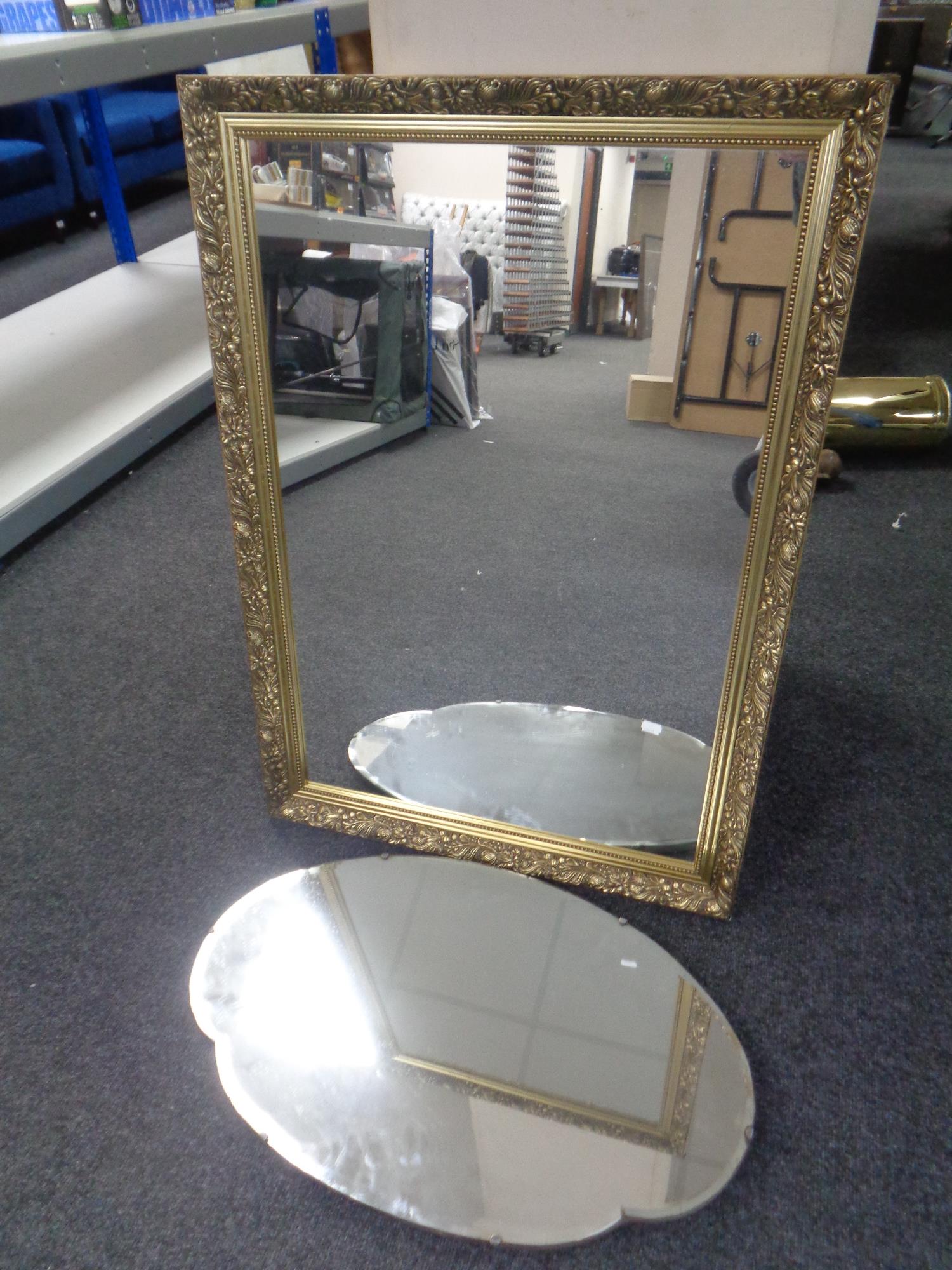 A gilt framed mirror together with a frameless mirror